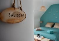 Łóżko lub łóżka w pokoju w obiekcie Home Emoi