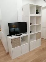 TV a/nebo společenská místnost v ubytování CASA DA PRAIA DA POÇA - APARTAMENTO TULIPA