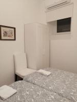Postel nebo postele na pokoji v ubytování CASA DA PRAIA DA POÇA - APARTAMENTO TULIPA