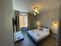 A bed or beds in a room at San Pietro Rooms 84