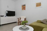 Televízia a/alebo spoločenská miestnosť v ubytovaní Apartments Nikica