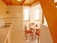 Kuchyň nebo kuchyňský kout v ubytování Apartments Boris