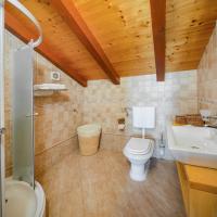 a bathroom with a toilet and a sink at Apartment Zlendic in Gornje Selo