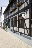 a black and white building with a sign on it at Pension Karina Schwerin in Schwerin