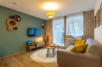 Telewizja i/lub zestaw kina domowego w obiekcie Le 05-GregIMMO-Appart'Hôtel