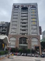 a building with a sign on the front of it at KDM Hotel in Taipei