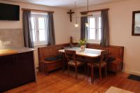 a dining room with a table and chairs at Holzer-Hof 