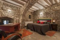 Postel nebo postele na pokoji v ubytování Castell de Fonolleres