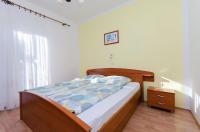 Postel nebo postele na pokoji v ubytování Apartments Darko