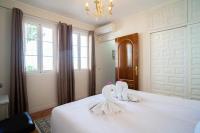 Posteľ alebo postele v izbe v ubytovaní Casa Ancladero Big rooftop terrace, 2 bedroom guesthouse w garden and view
