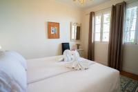Posteľ alebo postele v izbe v ubytovaní Casa Ancladero Big rooftop terrace, 2 bedroom guesthouse w garden and view