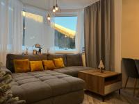 A seating area at LUX apartmany Romantika CHOPOK 7, 19
