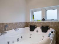 Koupelna v ubytování Holiday Home Hunlef - 400m from the sea by Interhome