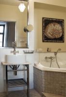 a bathroom with a sink and a tub at Boutique Hotel Nautilus in Tábor