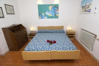 Posteľ alebo postele v izbe v ubytovaní Casa vacanze Gigli