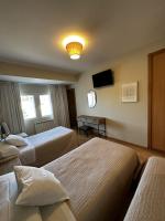 A bed or beds in a room at San Luis