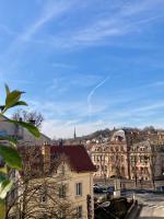a view of a city with buildings and a blue sky at Appartement avec terrasse et parking gratuit accolé in Montbéliard