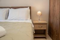 A bed or beds in a room at John's Studios