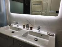 a white bathroom sink with a large mirror at Porte du Vieux Lyon 2, le long du quai in Lyon
