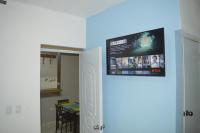 TV a/nebo společenská místnost v ubytování Apartamento Amueblado Caribe, Santo Domingo a 10 minutos del Aeropuerto Internacional de las Americas