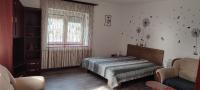 Posteľ alebo postele v izbe v ubytovaní Lugas Apartman