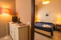 Łóżko lub łóżka w pokoju w obiekcie Santa Giulia Hotel e Residence Torino