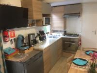 Kuchyňa alebo kuchynka v ubytovaní Mobilhome 3 chambres tout confort, proche de la plage