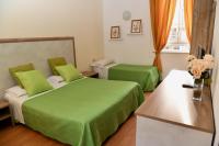 Posteľ alebo postele v izbe v ubytovaní Hotel Anacapri