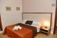Posteľ alebo postele v izbe v ubytovaní Hotel Anacapri