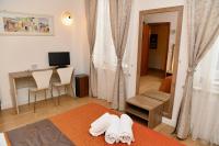 Televízia a/alebo spoločenská miestnosť v ubytovaní Hotel Anacapri