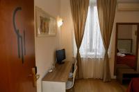Televízia a/alebo spoločenská miestnosť v ubytovaní Hotel Anacapri