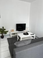 Televízia a/alebo spoločenská miestnosť v ubytovaní Belle maison