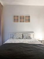 Posteľ alebo postele v izbe v ubytovaní Apartament przy Karmelu