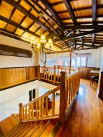 a large room with a wooden ceiling and a chandelier at 見晴花園山莊Sunshine Villa in Ren&#39;ai
