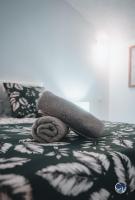 a towel sitting on top of a bed at Appartement neuf et moderne dans le centre ville in Bagnols-sur-Cèze