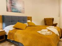 Łóżko lub łóżka w pokoju w obiekcie Apartament Pełen Słońca - Pinea Pobierowo