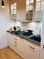 Kuchnia lub aneks kuchenny w obiekcie Apartament Pełen Słońca - Pinea Pobierowo