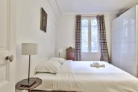 Łóżko lub łóżka w pokoju w obiekcie Appartement Caulain - Welkeys