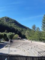 an empty amphitheater with a mountain in the background at T2 au cœur de la nature de Digne in Digne-les-Bains