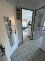 a room with a hallway with a mirror and a bathroom at T2 au cœur de la nature de Digne in Digne-les-Bains