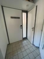 a room with two white doors and a tiled floor at T2 au cœur de la nature de Digne in Digne-les-Bains