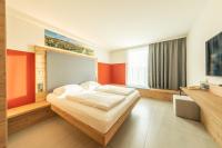 Postel nebo postele na pokoji v ubytování FAIR RESORT All Inclusive Wellness & Spa Hotel Jena