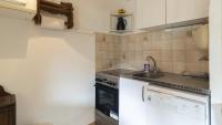 Kuchnia lub aneks kuchenny w obiekcie Eleuthera- 174- Appart en rez de jardin- 4pers