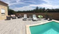 a patio with chairs and a swimming pool at Villa Emma 10 &#47; 12 personnes in Grignan