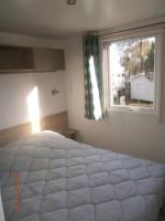 Posteľ alebo postele v izbe v ubytovaní Mobilhome 3 chambres tout confort, proche de la plage