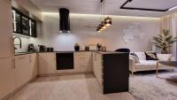 Kuchyňa alebo kuchynka v ubytovaní Apartament Bulwary Oświęcim