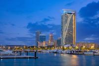 a city skyline with a marina and a tall building at W Dubai - Mina Seyahi in Dubai