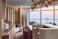 a kitchen and living room with a couch and a stove at W Dubai - Mina Seyahi in Dubai