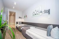 Posteľ alebo postele v izbe v ubytovaní InPoint Central Suites with Parking Available