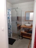 a bathroom with a shower and a sink at Studio Cosy AFWA in Les Abymes